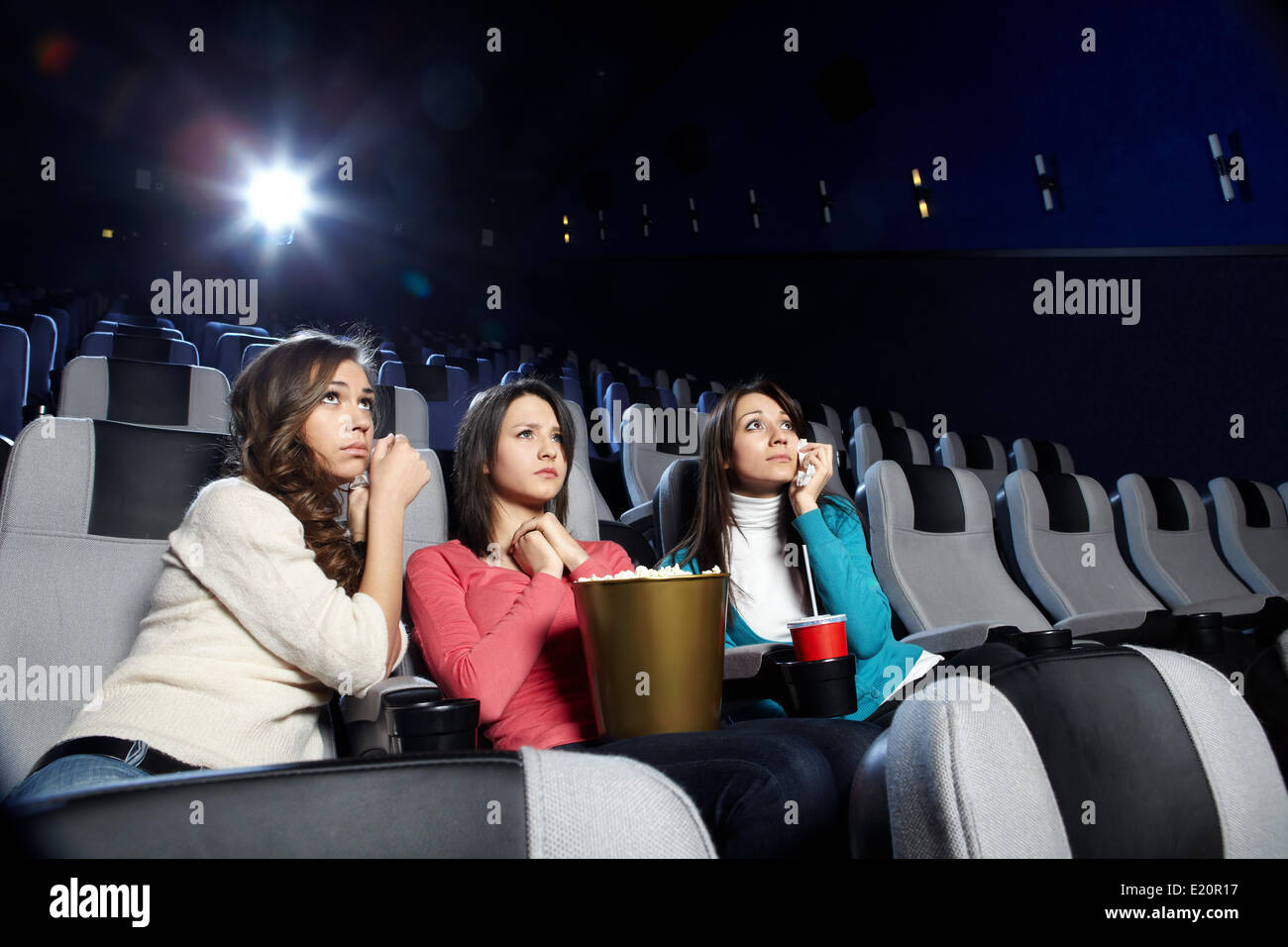 Young girls at viewing of sad cinema Stock Photo