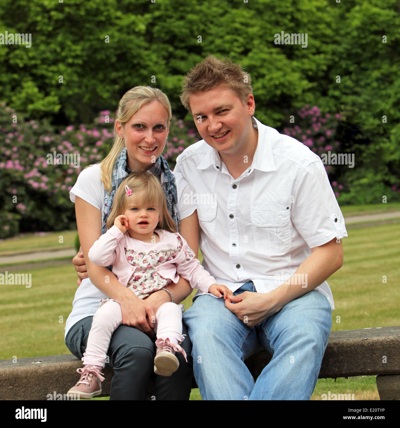 A young family with a child in the park Stock Photo