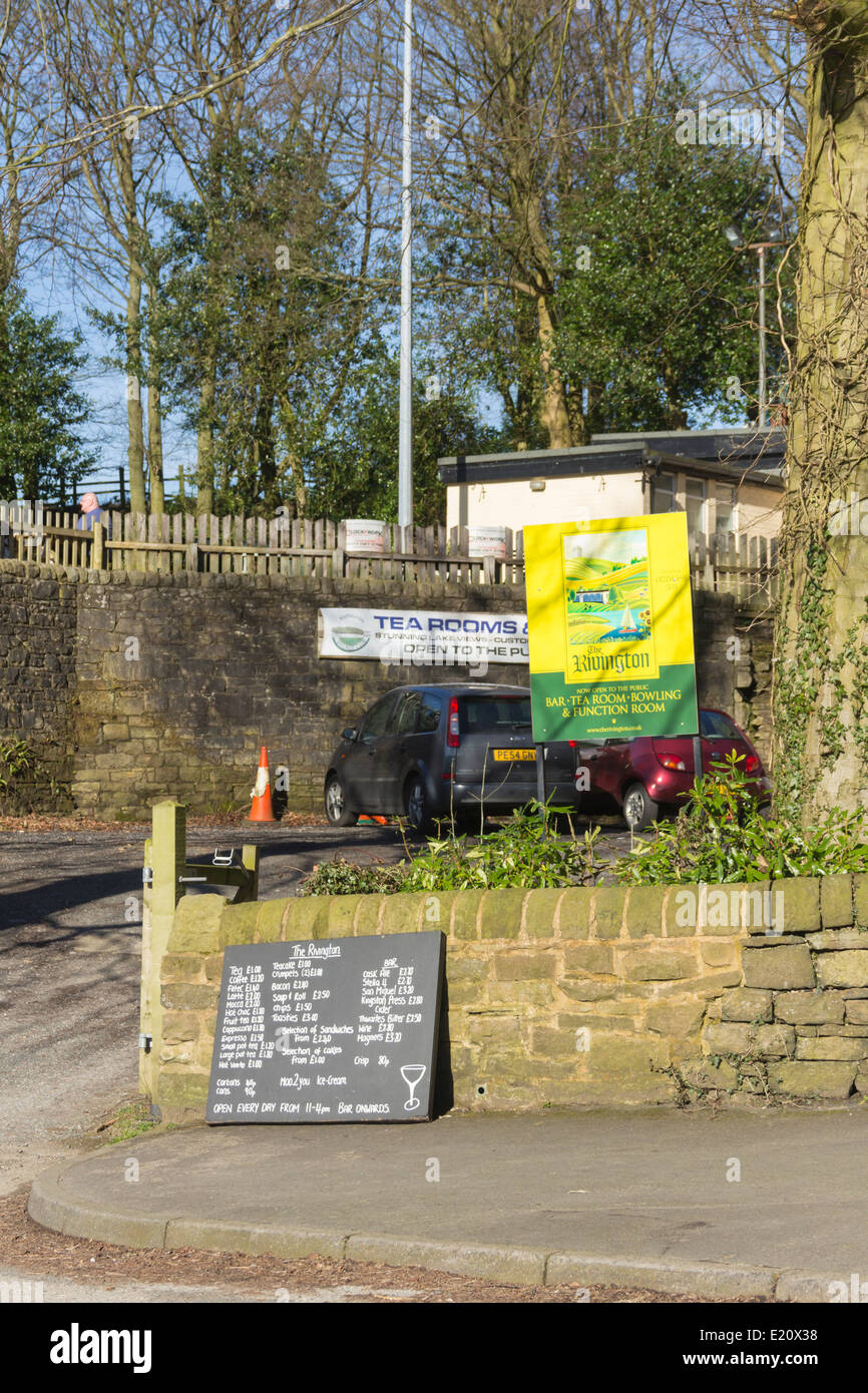 Signs, menu and price list outside the road entrance to the Rivington Bowling Club and Tearoom in Rivington, Lancashire. Stock Photo