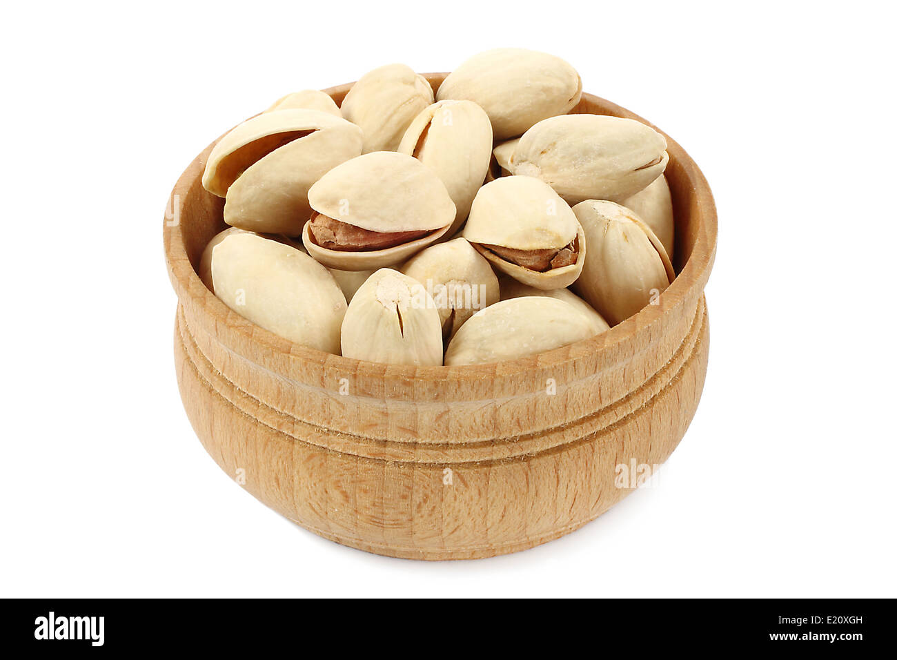 Pistachios in wooden bowl on white background Stock Photo Alamy