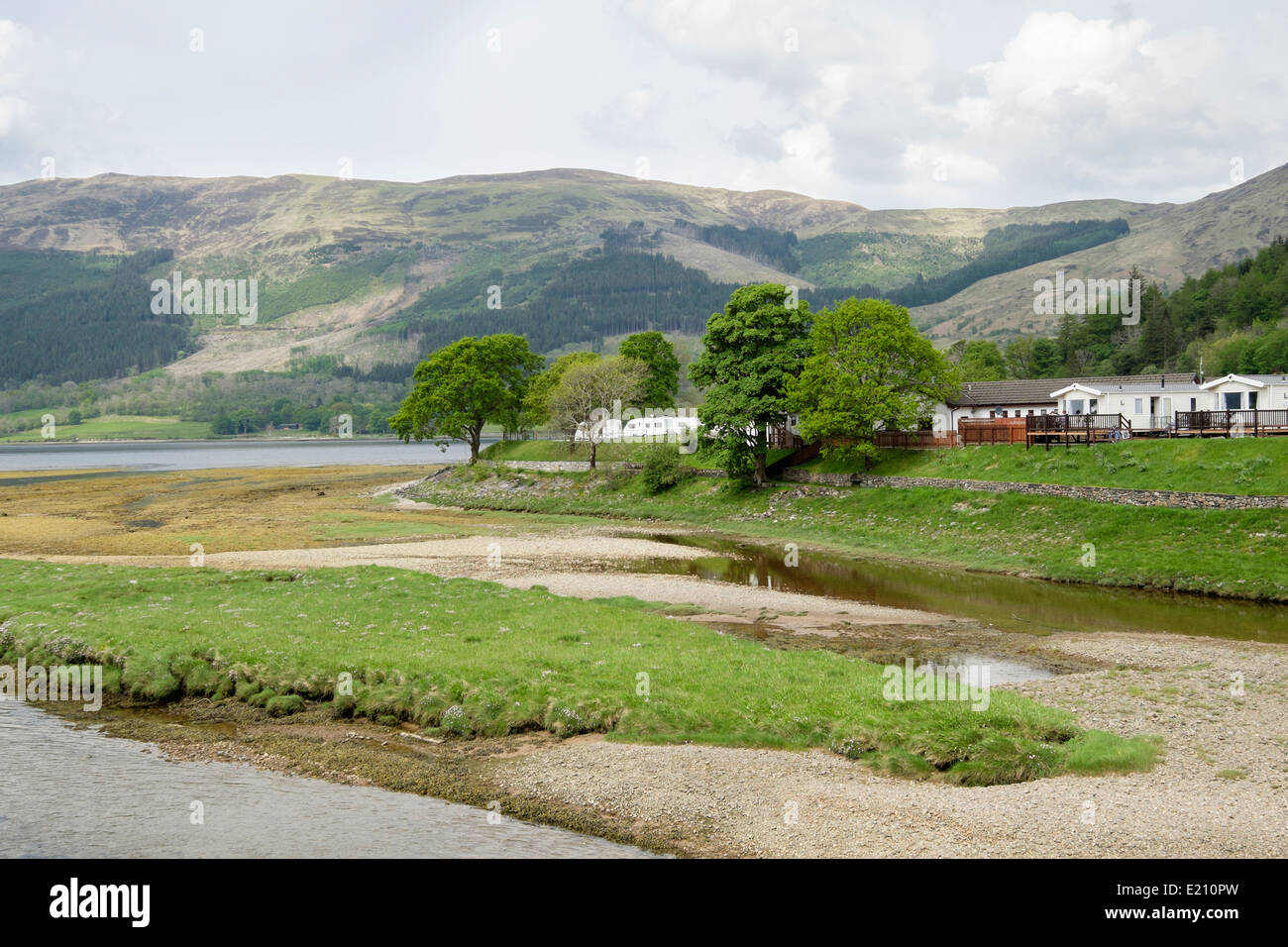 View across River Coe estuary to campsite with a view on banks of Loch Leven. Invercoe, Glencoe, Highland, Scotland, UK, Britain Stock Photo