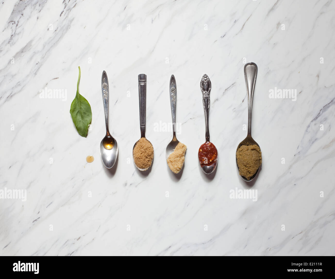 Asian spices in spoons Stock Photo