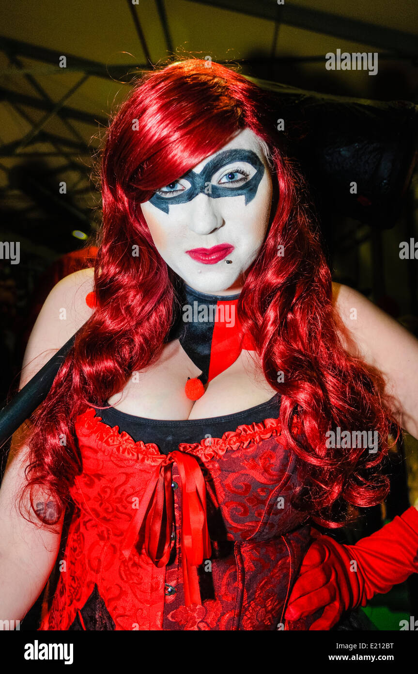 Woman attends Comicon dressed as Harlequin from Batman Stock Photo