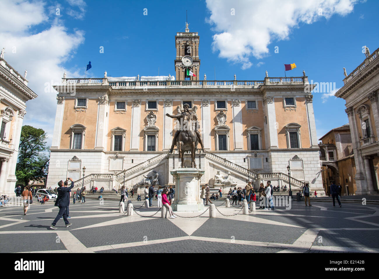 rome,italy-April 17,2014:tourists stroll near the capitoline museums in rome in a sunny day Stock Photo