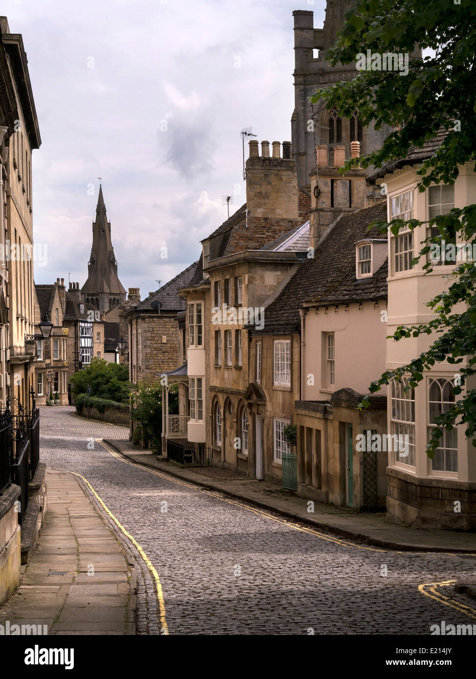 Old narrow cobbled street with stone houses, Barn Hill and All Saints Place, Stamford, Lincolnshire, England, UK Stock Photo