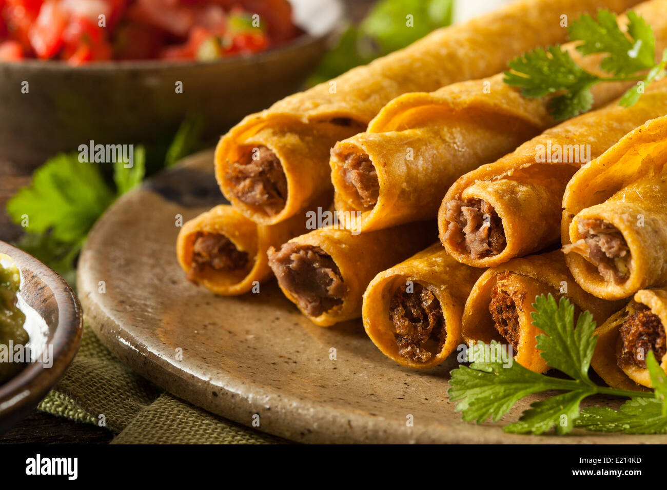 Homemade Mexican Beef Taquitos with Cilantro and Salsa Stock Photo Alamy