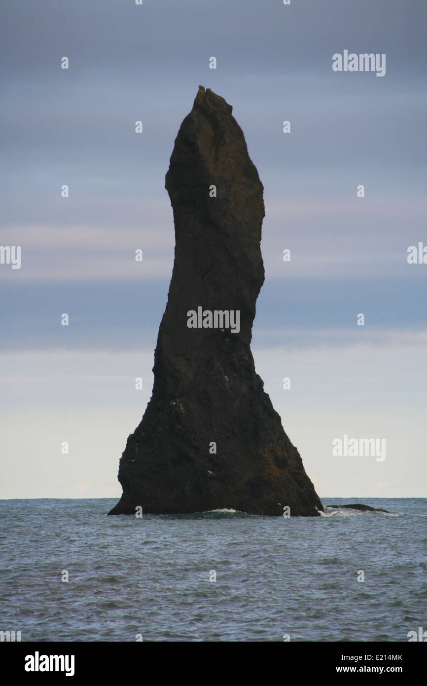Reynisdrangar, a basalt stack of 66 meters on the coast of Vik i Myrdal in the south of Iceland. Stock Photo