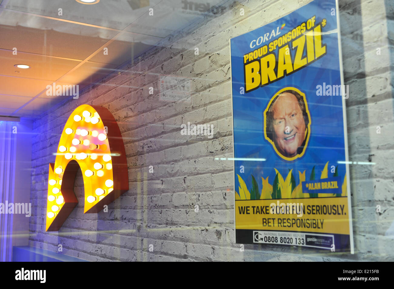 Old Compton Street, London, UK. 12th June 2014. A Coral betting shop in Soho has a World Cup theme. Credit:  Matthew Chattle/Alamy Live News Stock Photo
