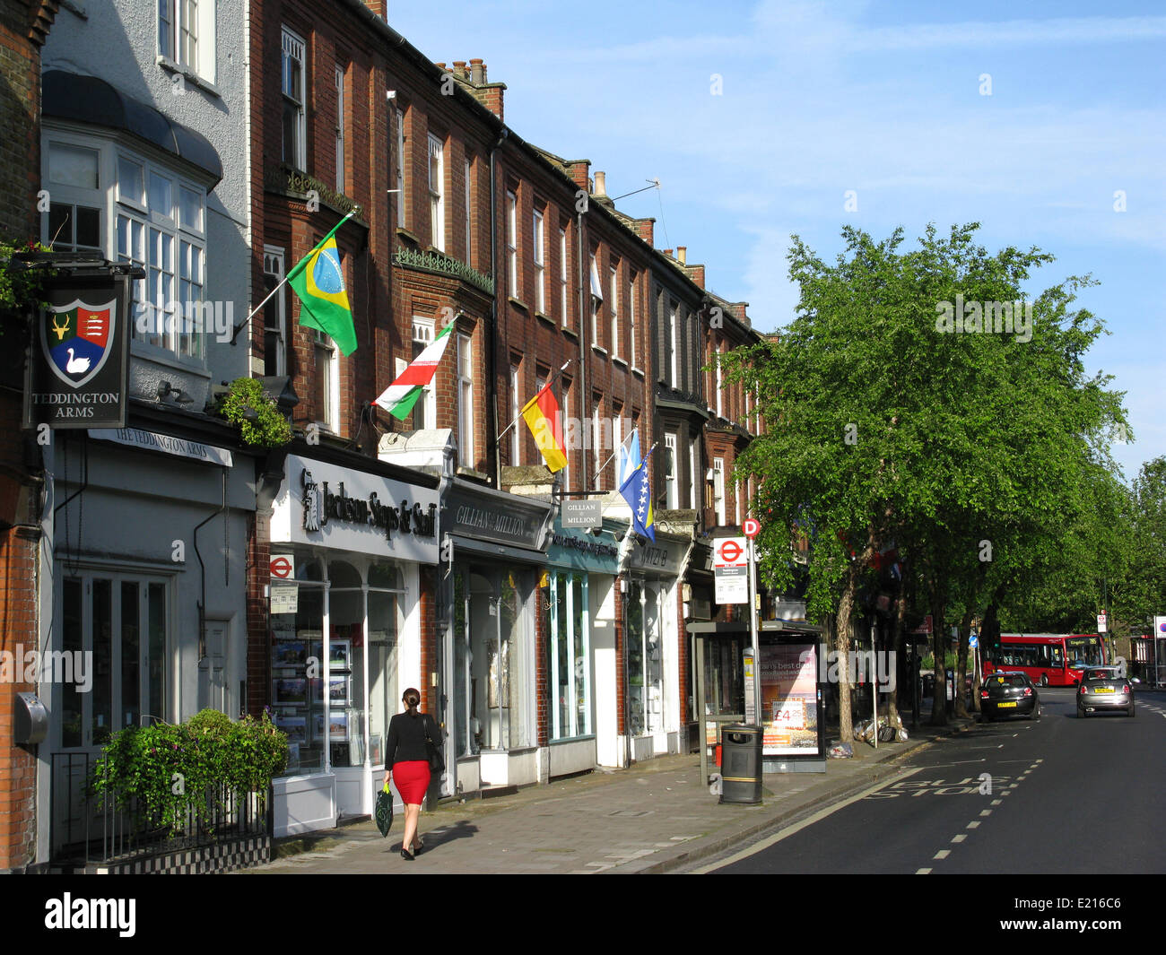 National flags of the competing countries line Teddington High Street to mark the beginning of the 2014 FIFA Football World Cup in Brazil. Credit:  Ian Bottle/Alamy Live News Stock Photo