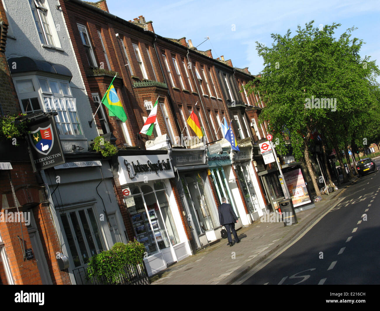 National flags of the competing countries line Teddington High Street to mark the beginning of the 2014 FIFA Football World Cup in Brazil. Credit:  Ian Bottle/Alamy Live News Stock Photo