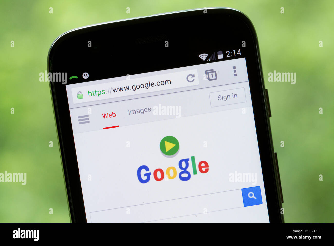 Google website displayed on the screen of a Motorola, Moto G cellphone, mobile phone. Stock Photo