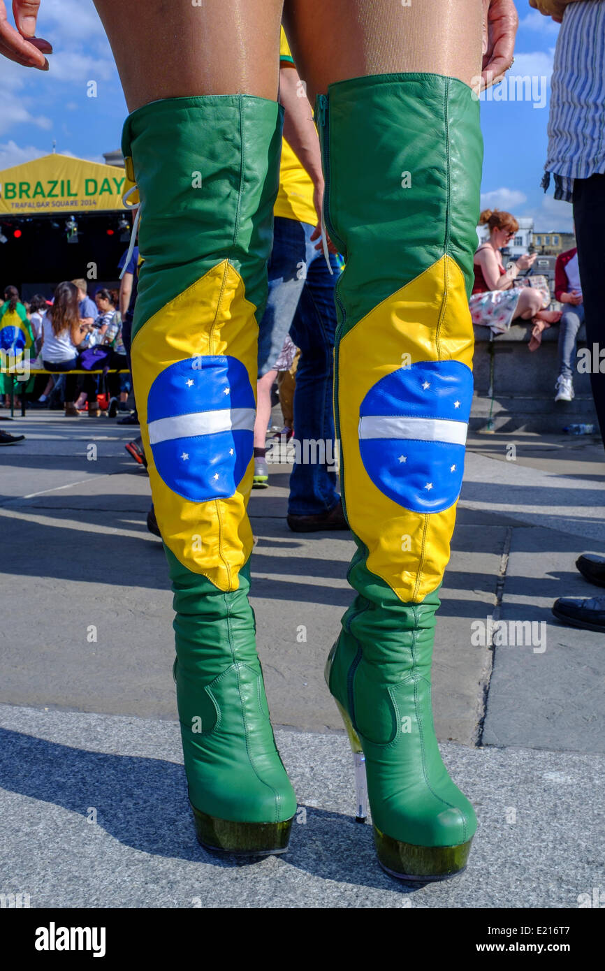 London, UK. 12th June, 2014. To celebrate the kick off of the 2014 World Cup Trafalgar Square in London hosted Brazil Day, a festival of Brazilian culture. Visitors had the opportunity to experience Brazilian dance, music, football and food. Pictured. A woman wears knee high leather boots in the design of the Brazilian flag. Credit:  mark phillips/Alamy Live News Stock Photo