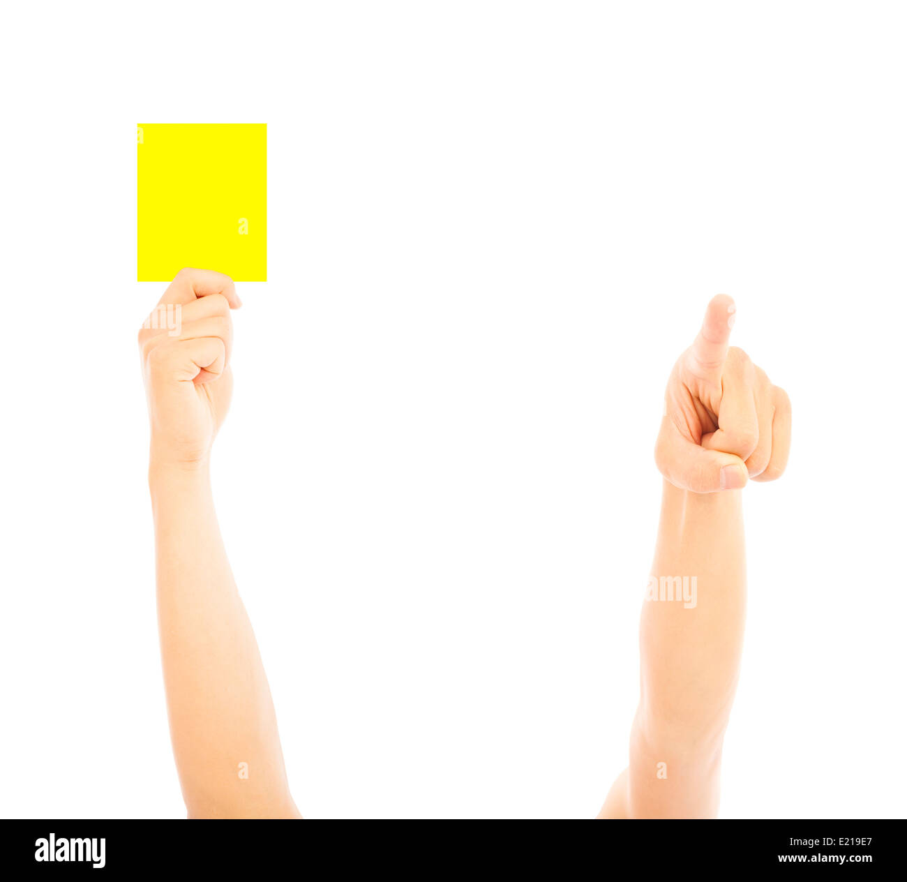Hand of referee with yellow card to warn Stock Photo