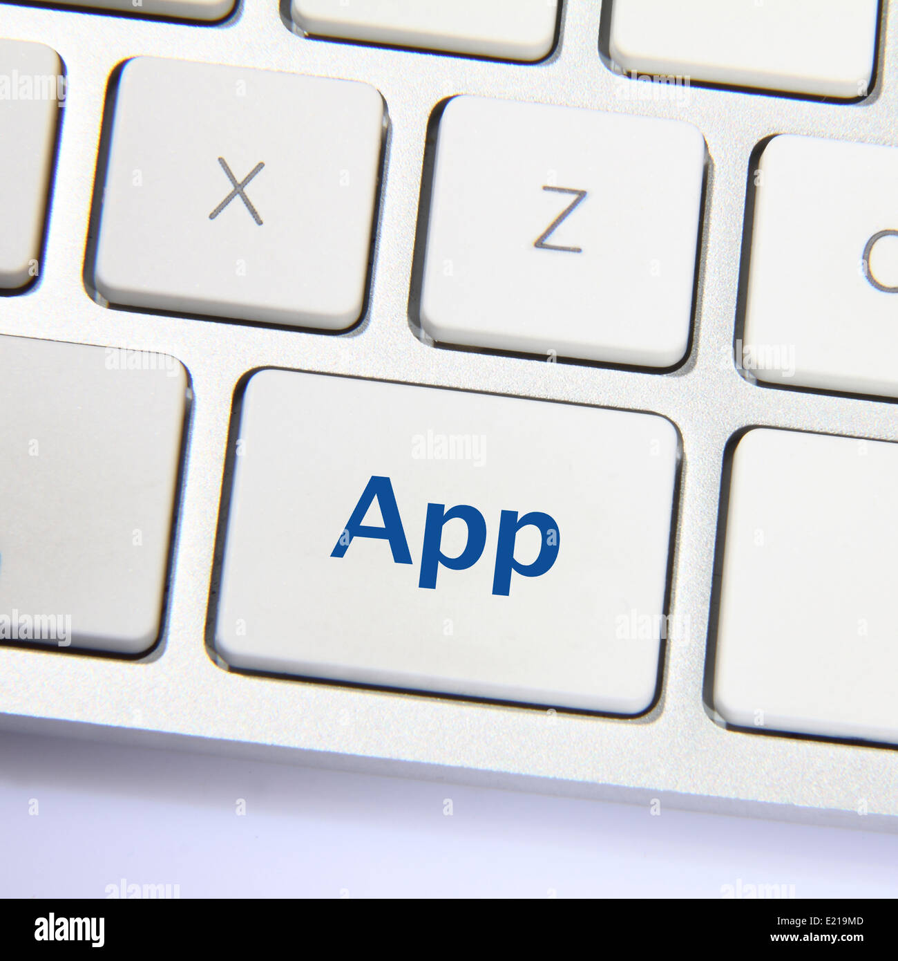 Photo of app button on the white keyboard Stock Photo - Alamy