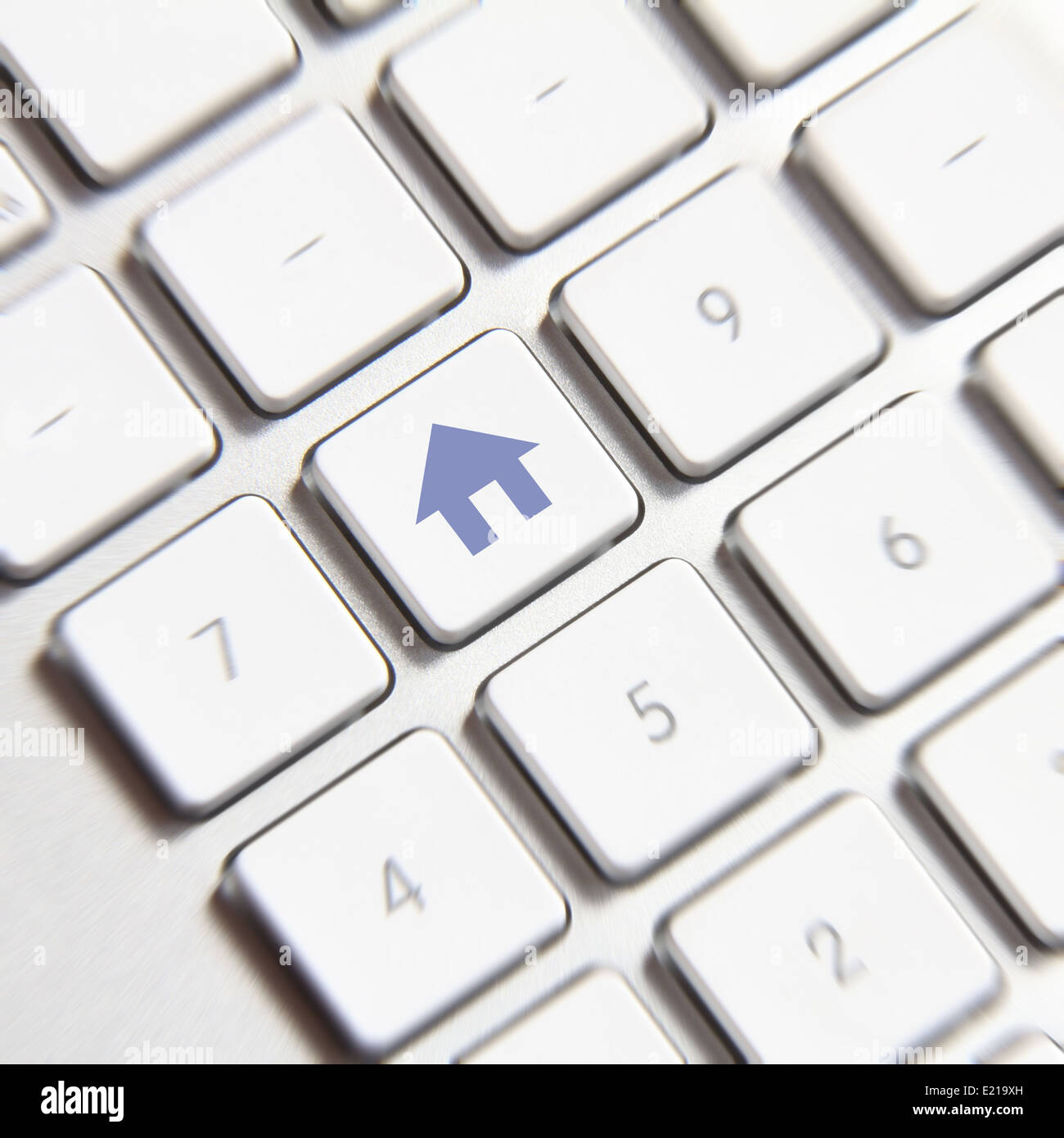 Photo of home symbol button on the white keyboard. Stock Photo