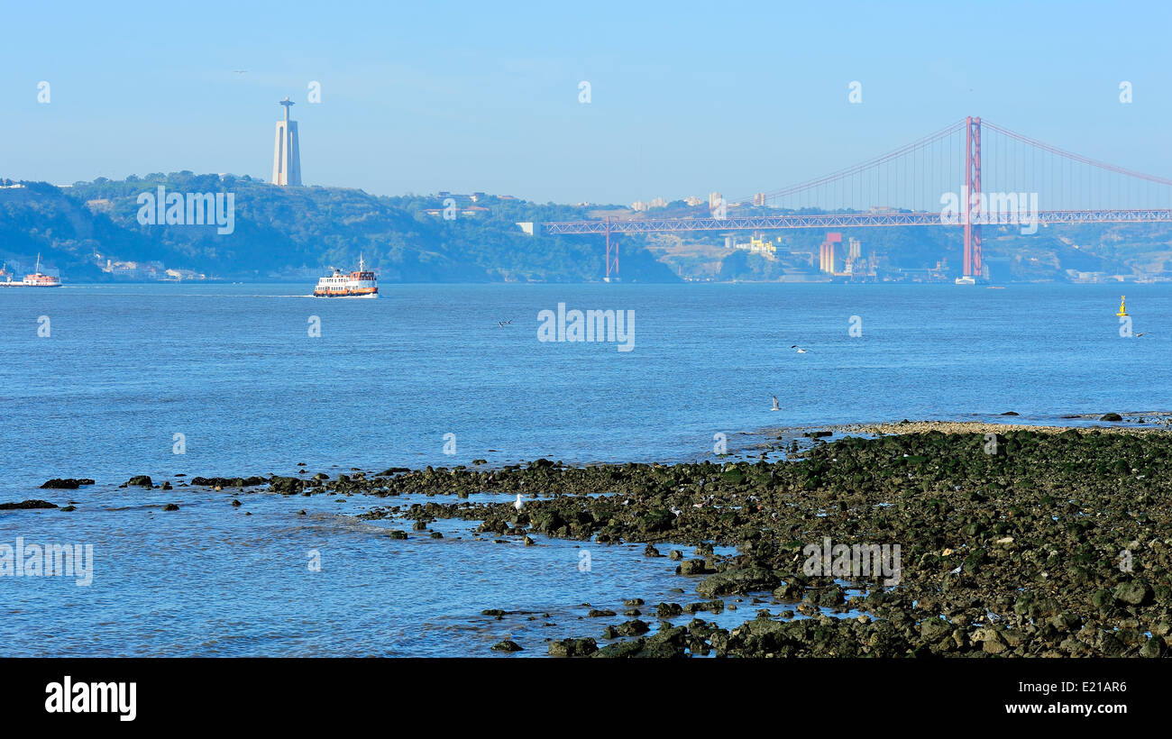 coast of river Tagus and the 25th of April Bridge, Lisbon, Portugal Stock Photo