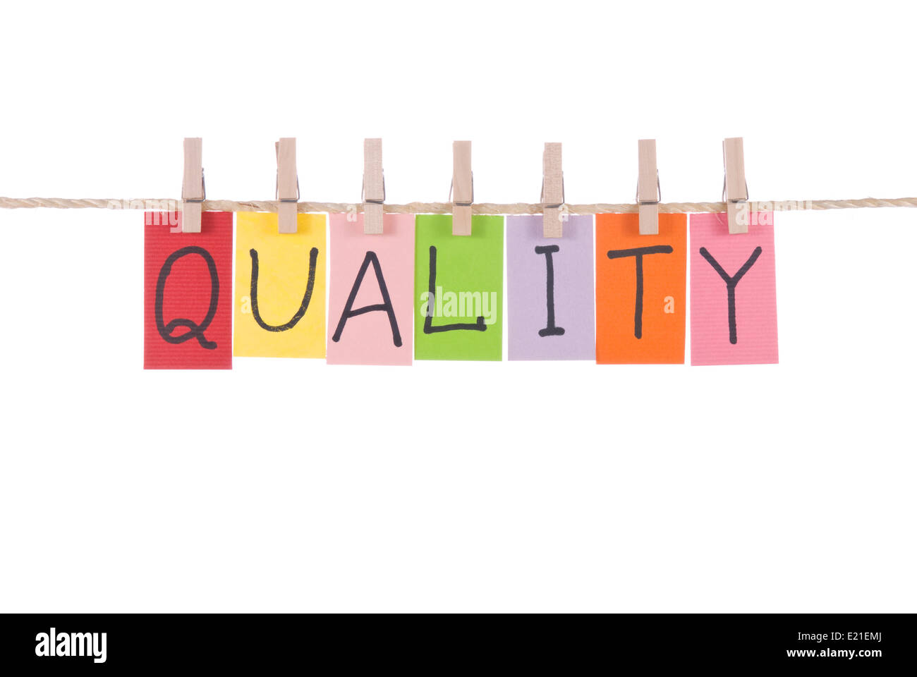 Quality, words hang by wooden peg Stock Photo Alamy