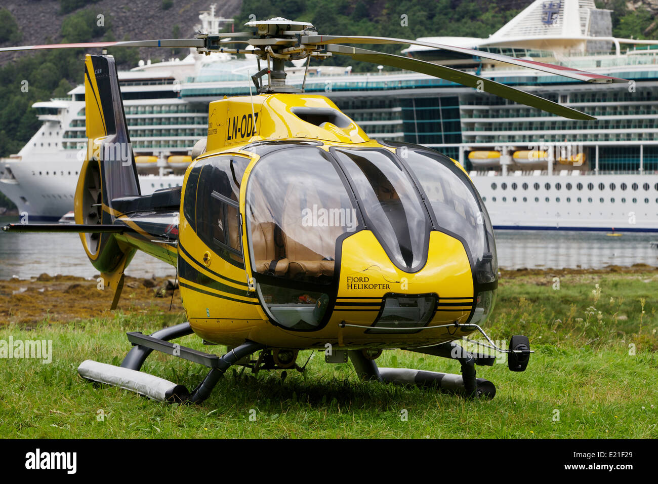 Helicopter in front of cruise ship in Norwegian fjord Stock Photo Alamy