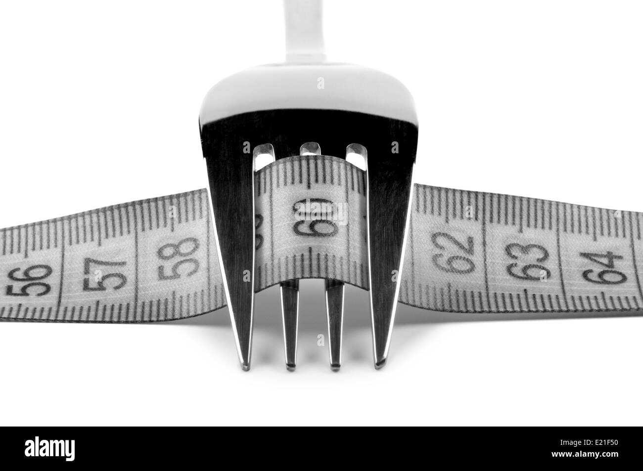 Fork with ruler. Concept nutrition and diet. Stock Photo