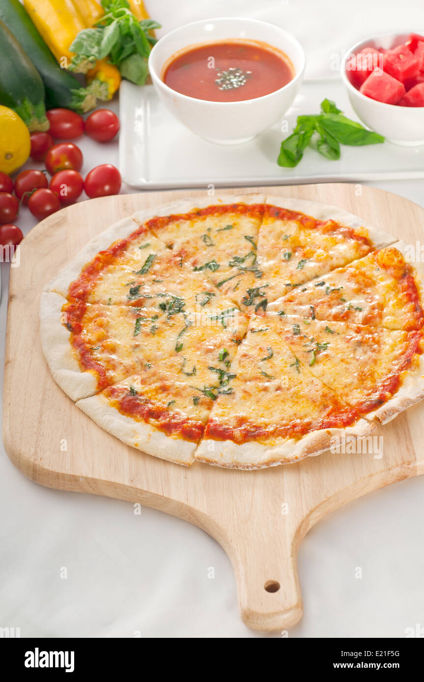Italian original thin crust pepperoni pizza Stock Photo - Alamy