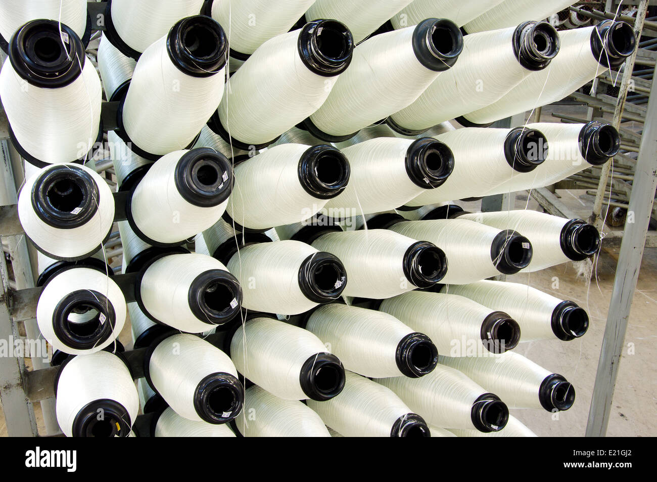 Bobbins weaver's manufacture. Of these strings make a cloth Stock Photo ...
