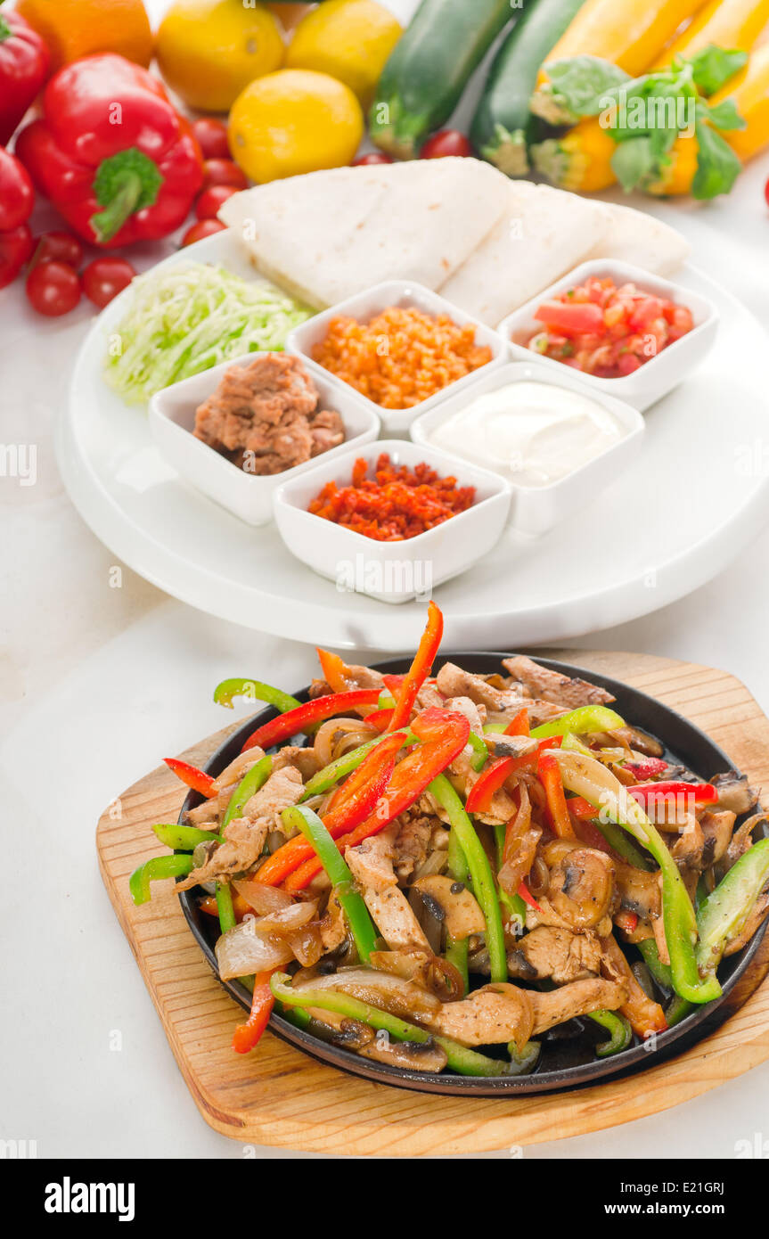 original fajita sizzling hot on iron plate Stock Photo Alamy