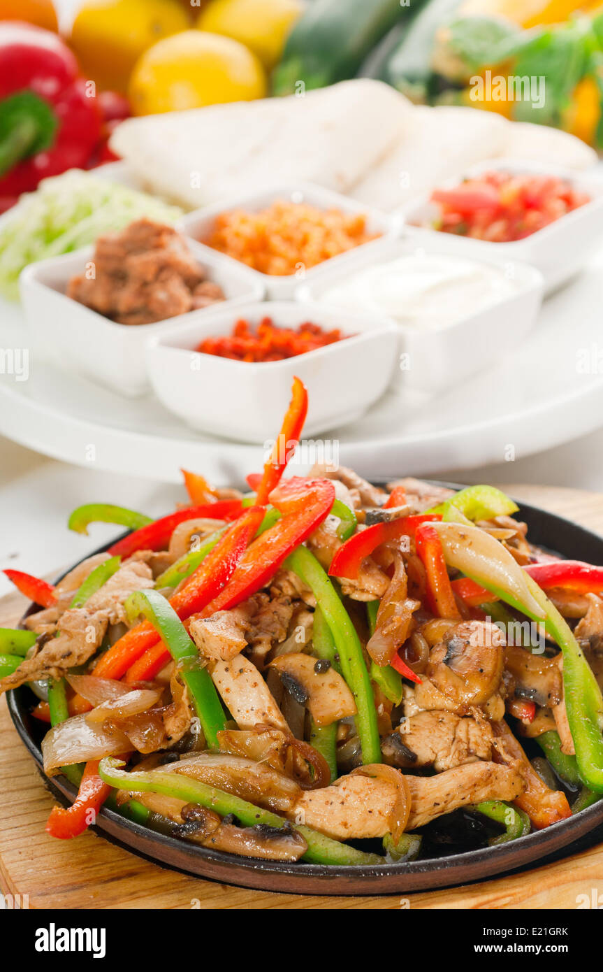 original fajita sizzling hot on iron plate Stock Photo Alamy