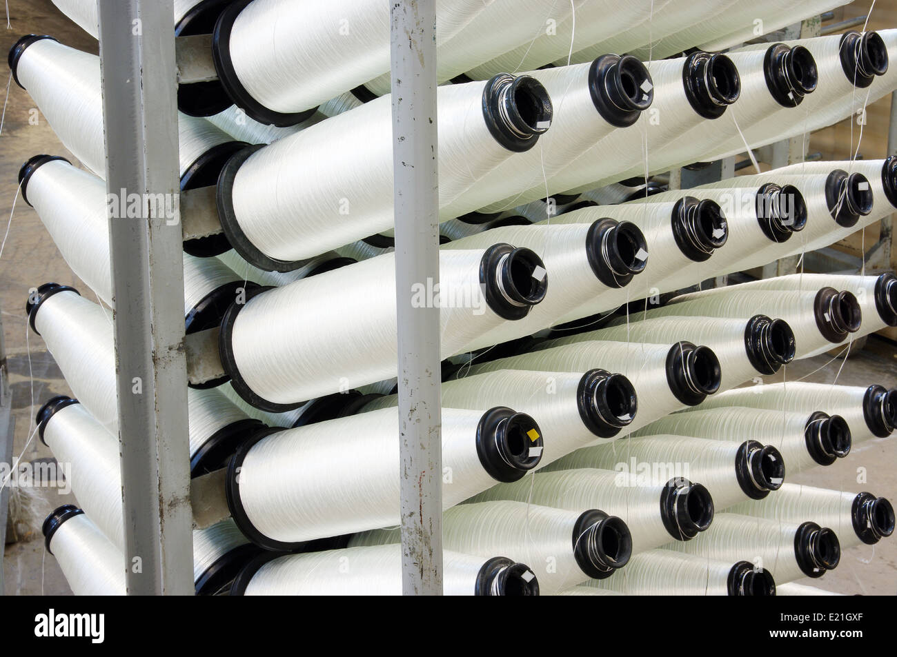 Bobbins weaver's manufacture. Of these strings make a cloth Stock Photo ...