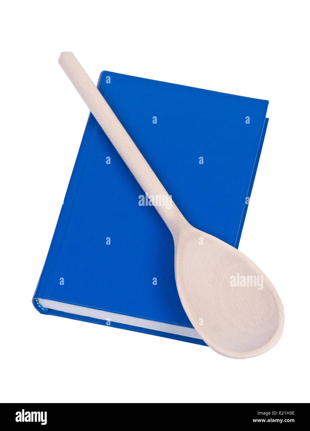 Book wit wooden spoon above. Stock Photo