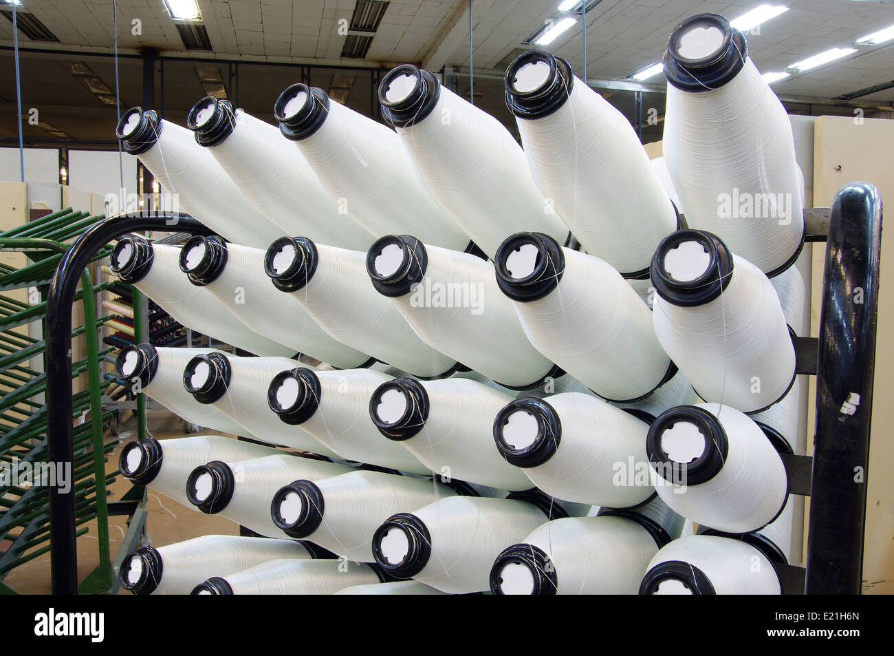Bobbins weaver's manufacture. Of these strings make a cloth Stock Photo ...