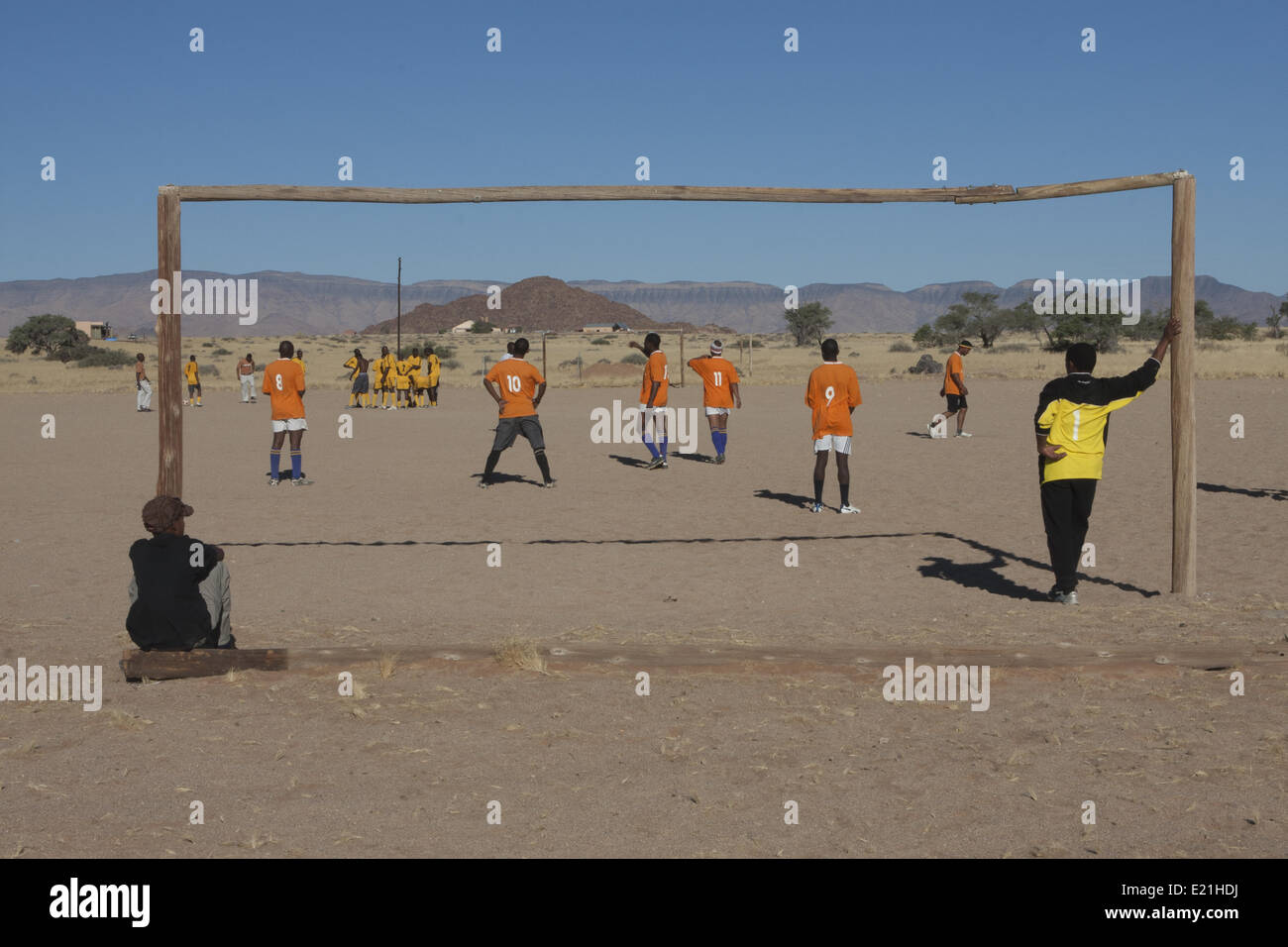 Playing soccer in desert dust beneath the Rifa-Fort, Rifa, Kingdom