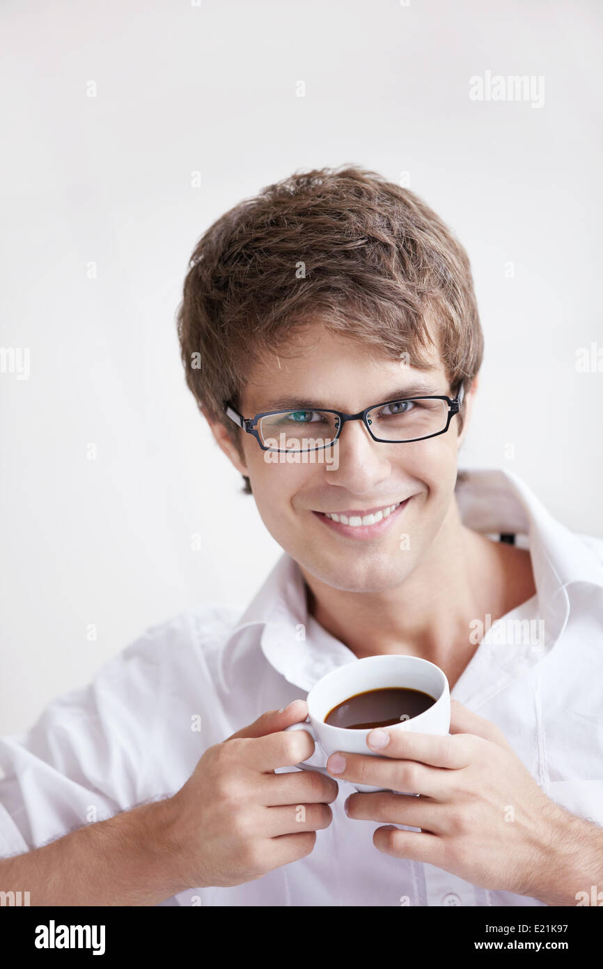 Handsome man cup coffee looking hires stock photography and images Alamy — free download