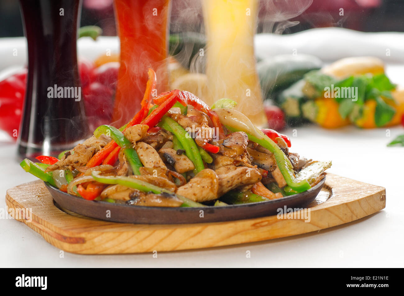 original fajita sizzling hot on iron plate Stock Photo Alamy