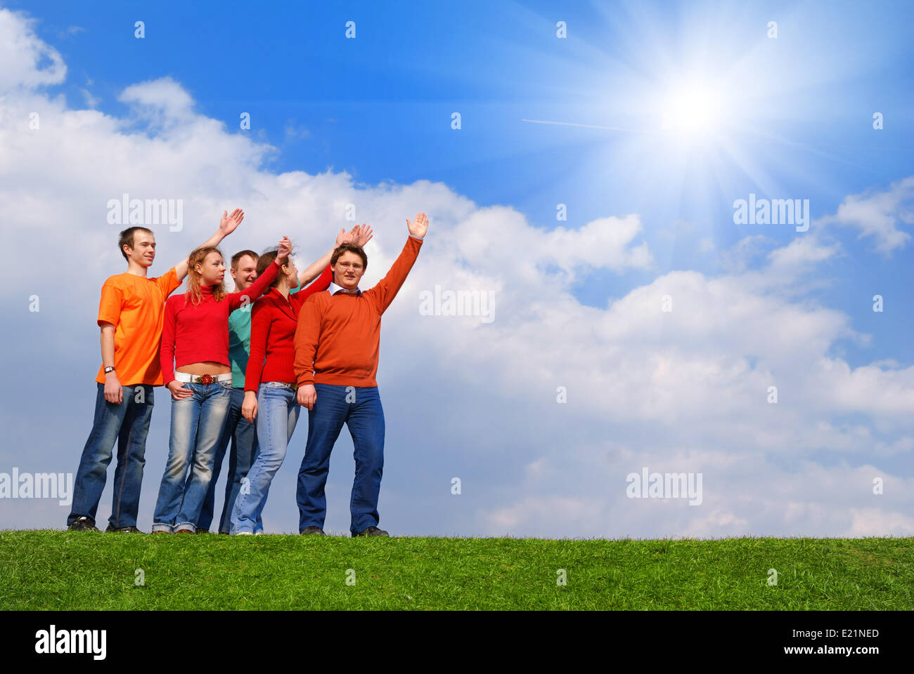 Group of people pointing to sky Stock Photo