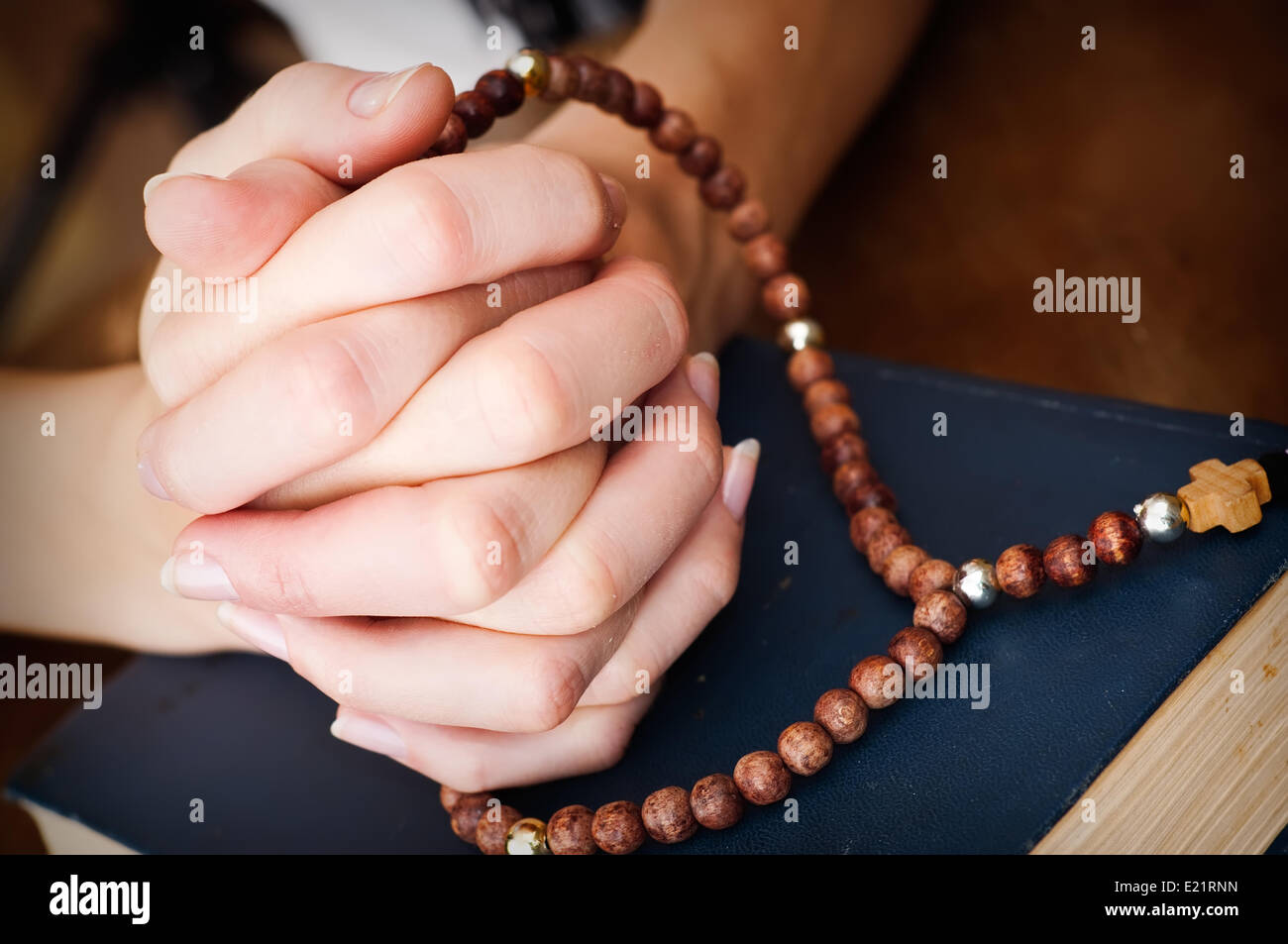 female hands praying Stock Photo