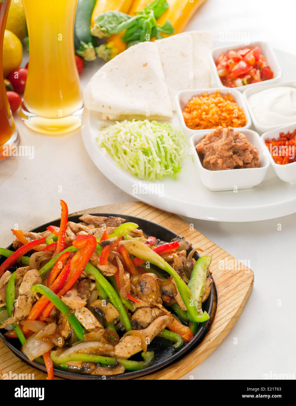 original fajita sizzling hot on iron plate Stock Photo Alamy