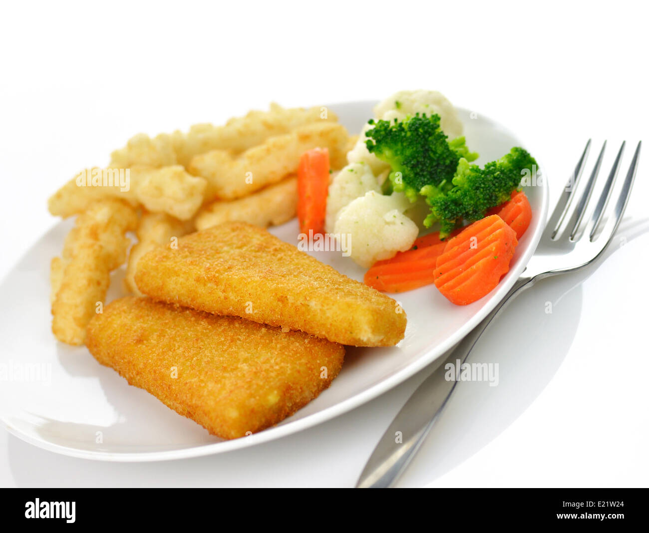fish fillets with fried potato and vegetables Stock Photo
