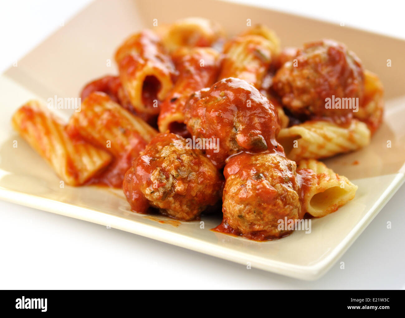 Rigatoni with tomato sauce and meatballs. Stock Photo
