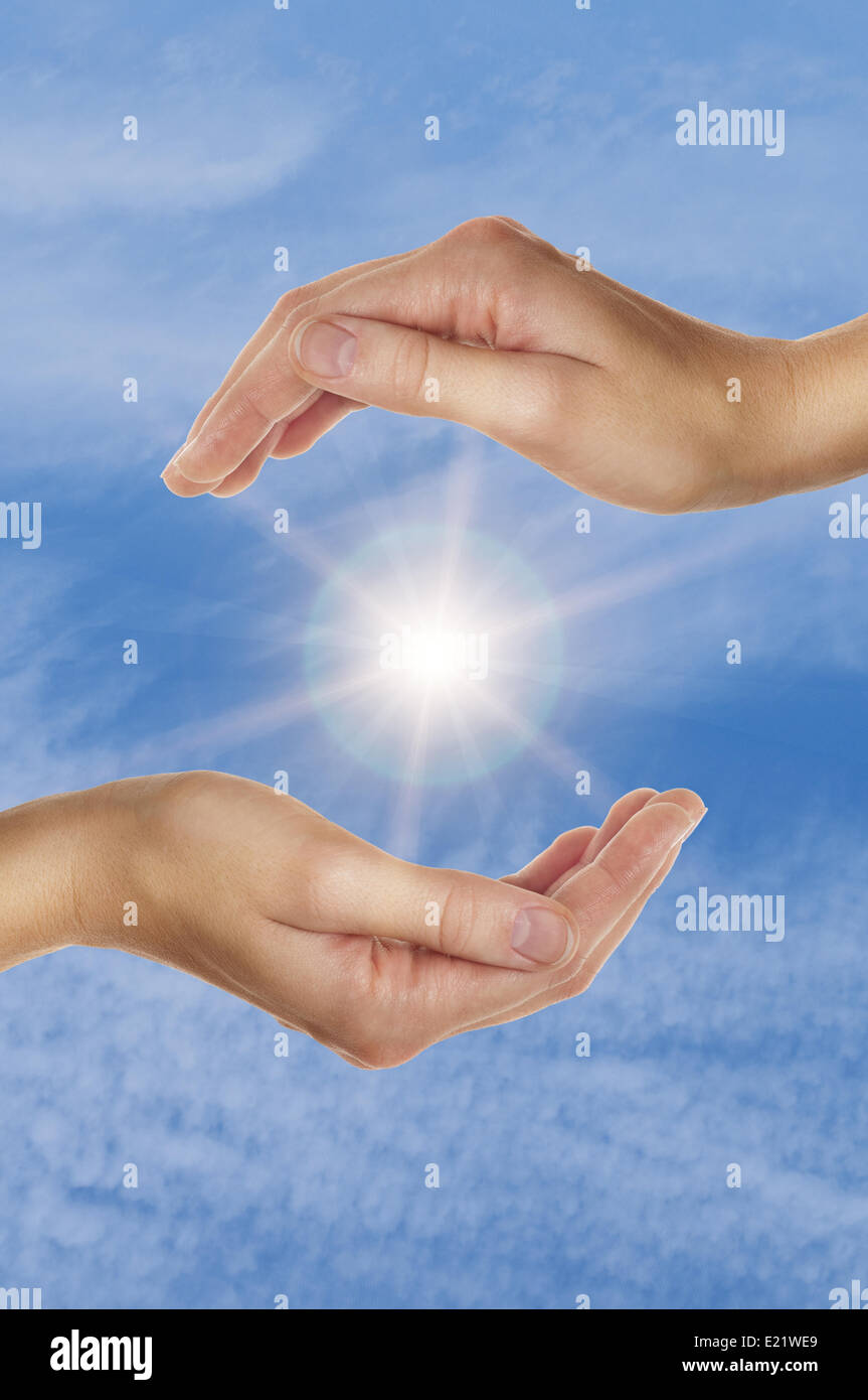 female hands over blue sky with clouds Stock Photo - Alamy