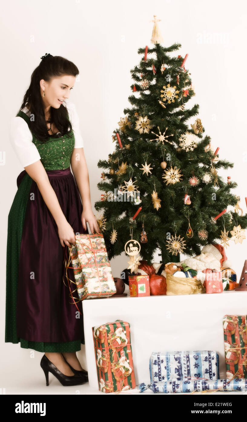 Bavarian Girl with Christmas present Stock Photo
