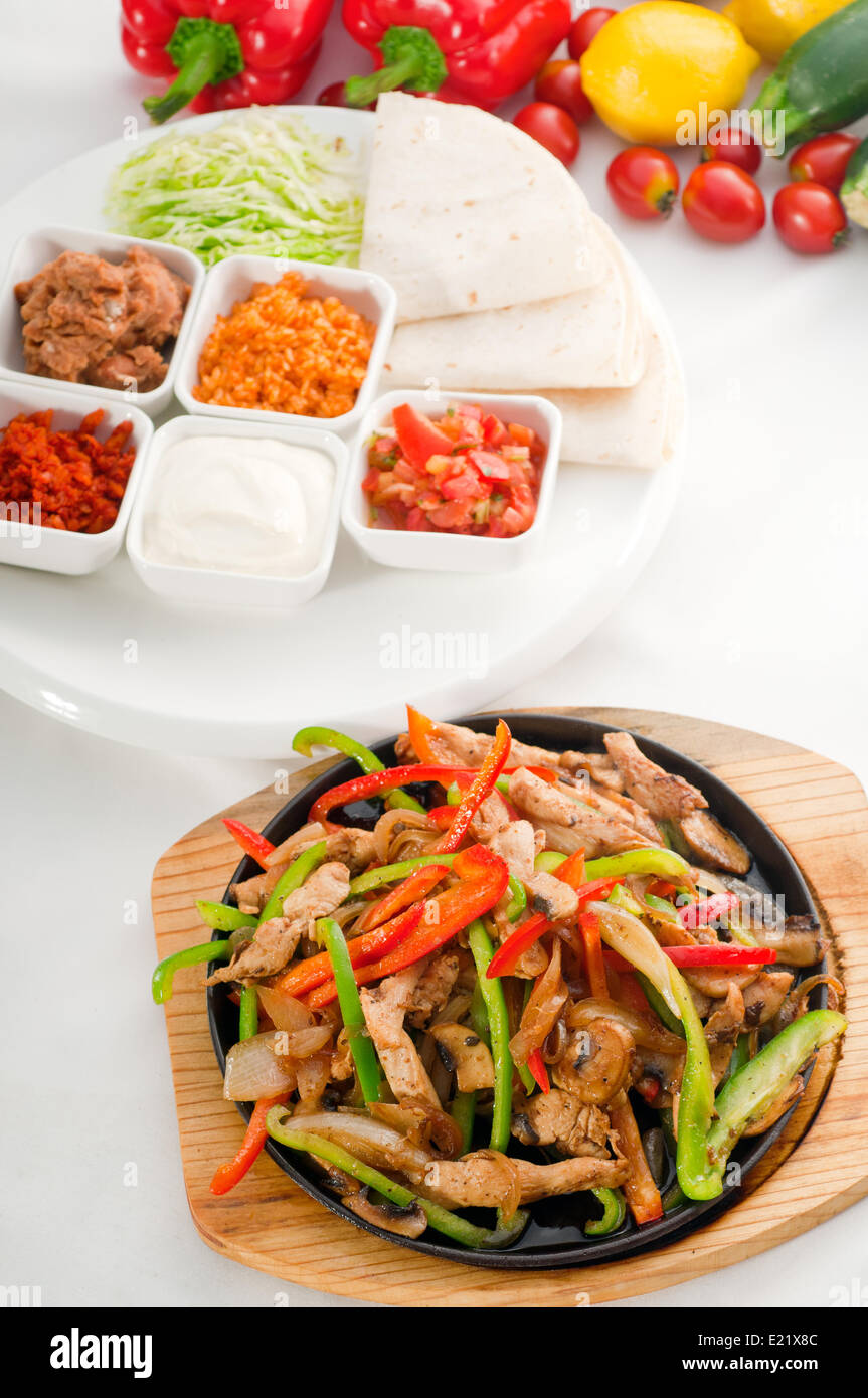 original fajita sizzling hot on iron plate Stock Photo Alamy