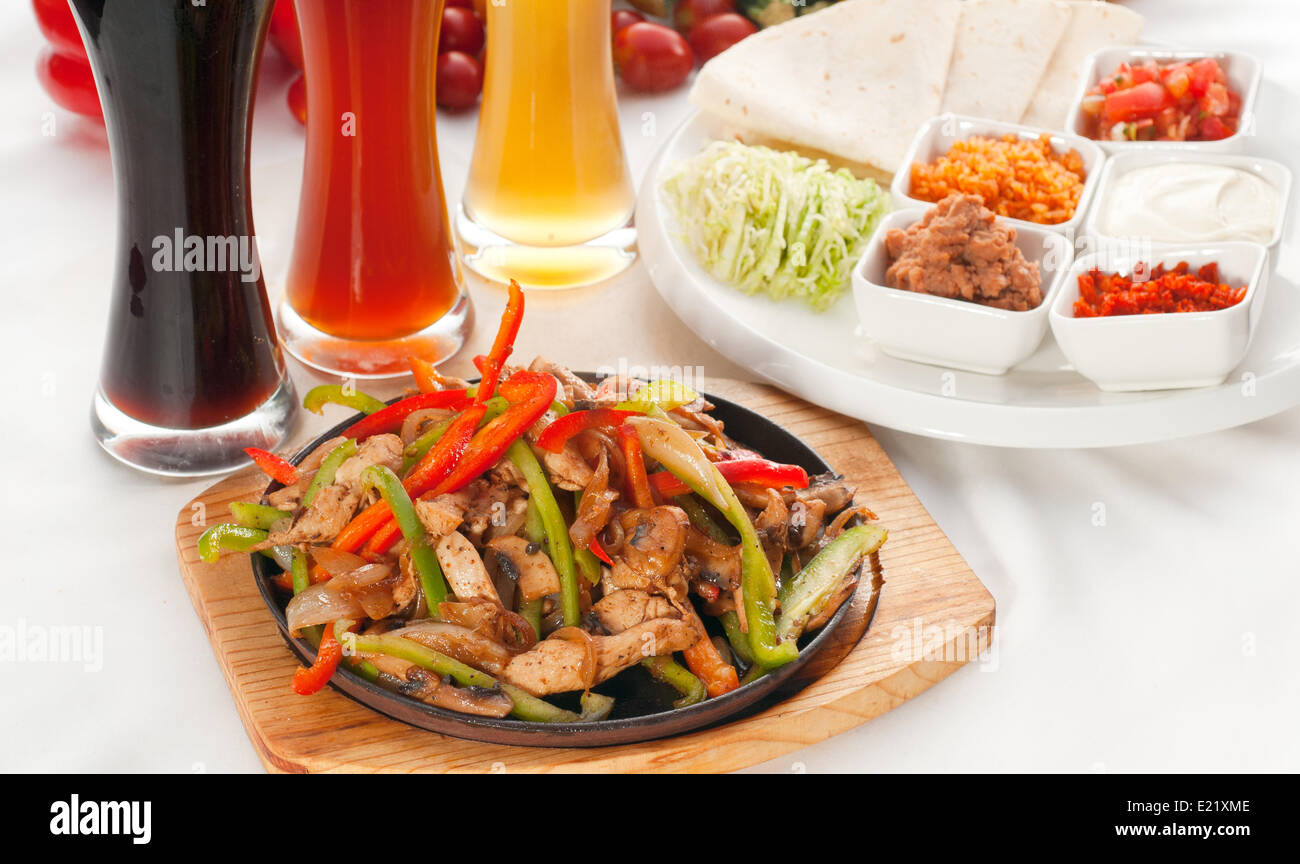 original fajita sizzling hot on iron plate Stock Photo Alamy