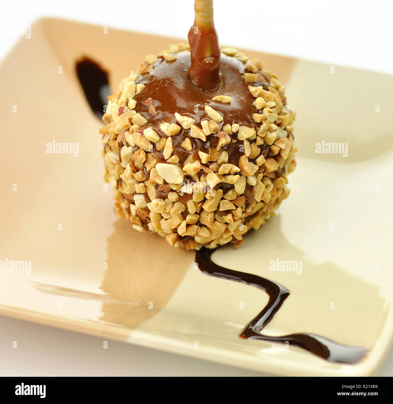 Candy apple with caramel sauce Stock Photo