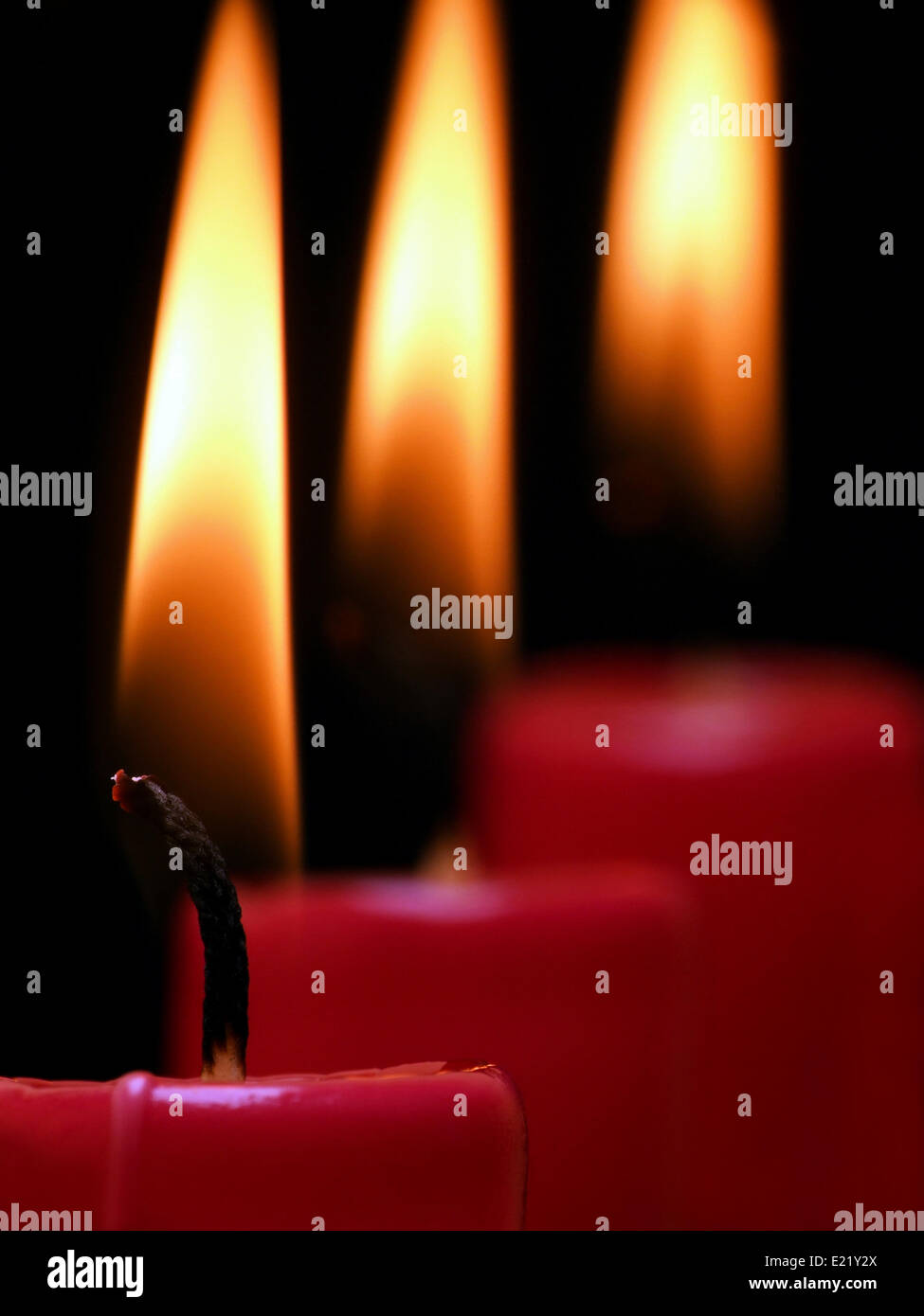 three lighted candles Stock Photo