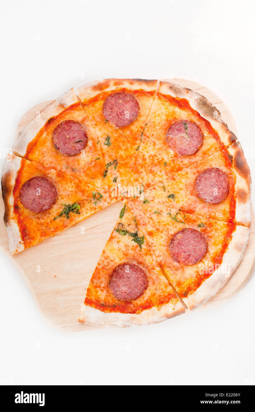Italian original thin crust pepperoni pizza Stock Photo - Alamy