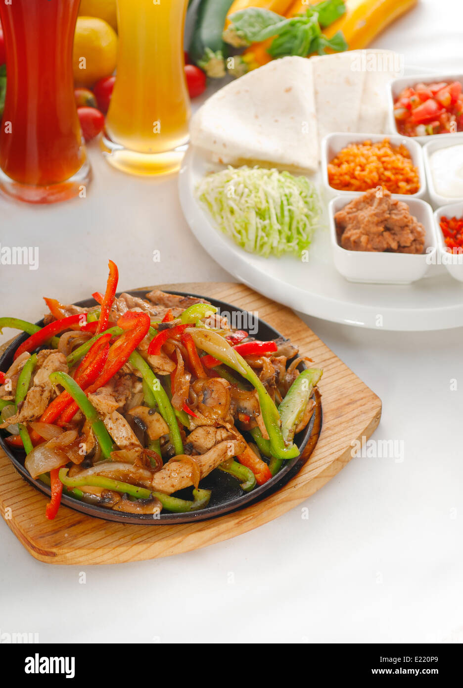 original fajita sizzling hot on iron plate Stock Photo Alamy