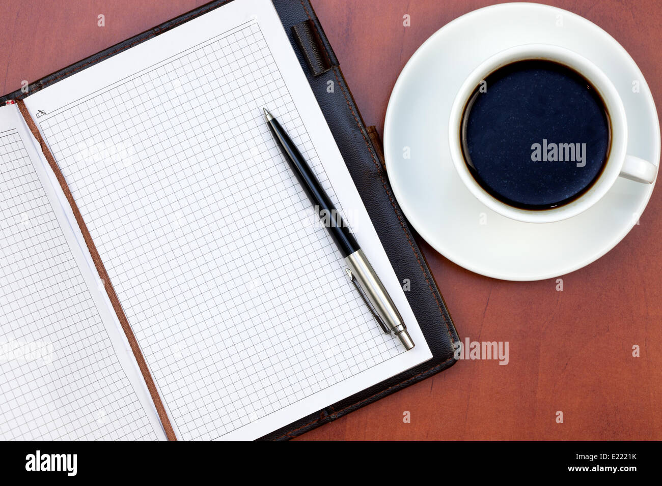 Coffee cup, notebook and pen Stock Photo