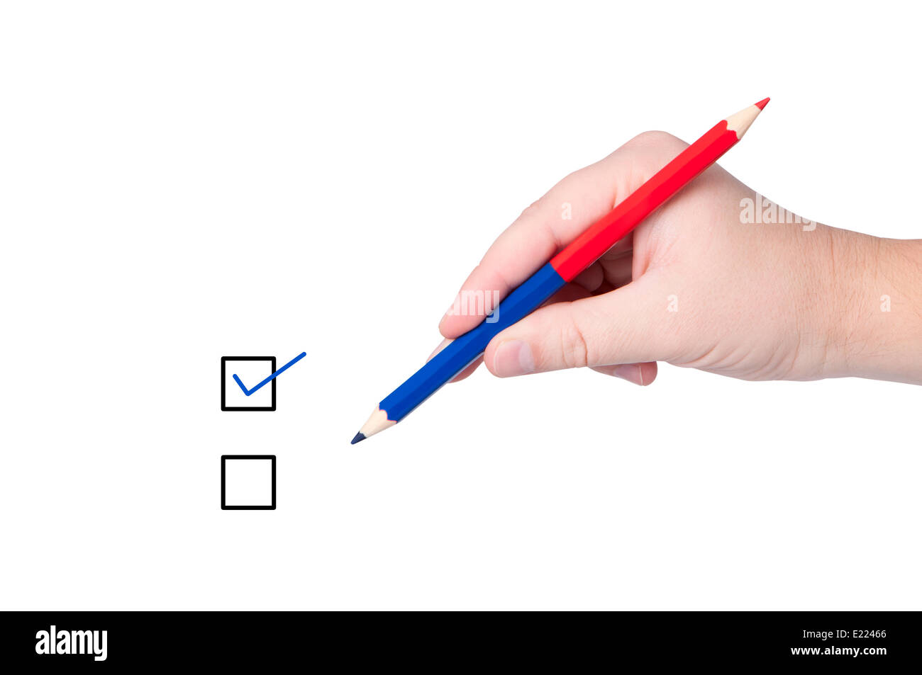 Hand with pencil makes mark. Stock Photo