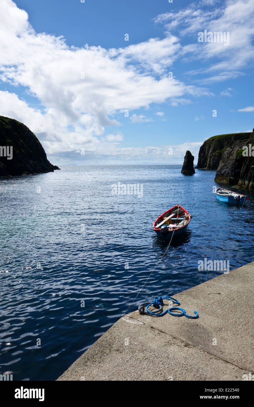 Small fishing boats in cove Pier harbour Ougue Port Malin Beg County  Donegal Ireland Stock Photo - Alamy