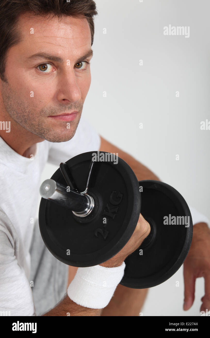 portrait of a man with dumbbell Stock Photo - Alamy